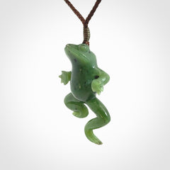 A hand carved jade frog pendant - he's carved to make you smile!