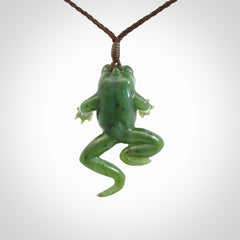 A hand carved jade frog pendant - he's carved to make you smile!