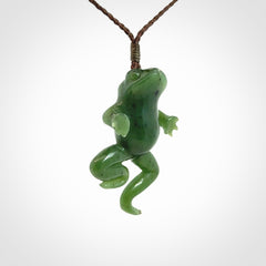A hand carved jade frog pendant - he's carved to make you smile!