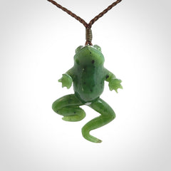 A hand carved jade frog pendant - he's carved to make you smile!