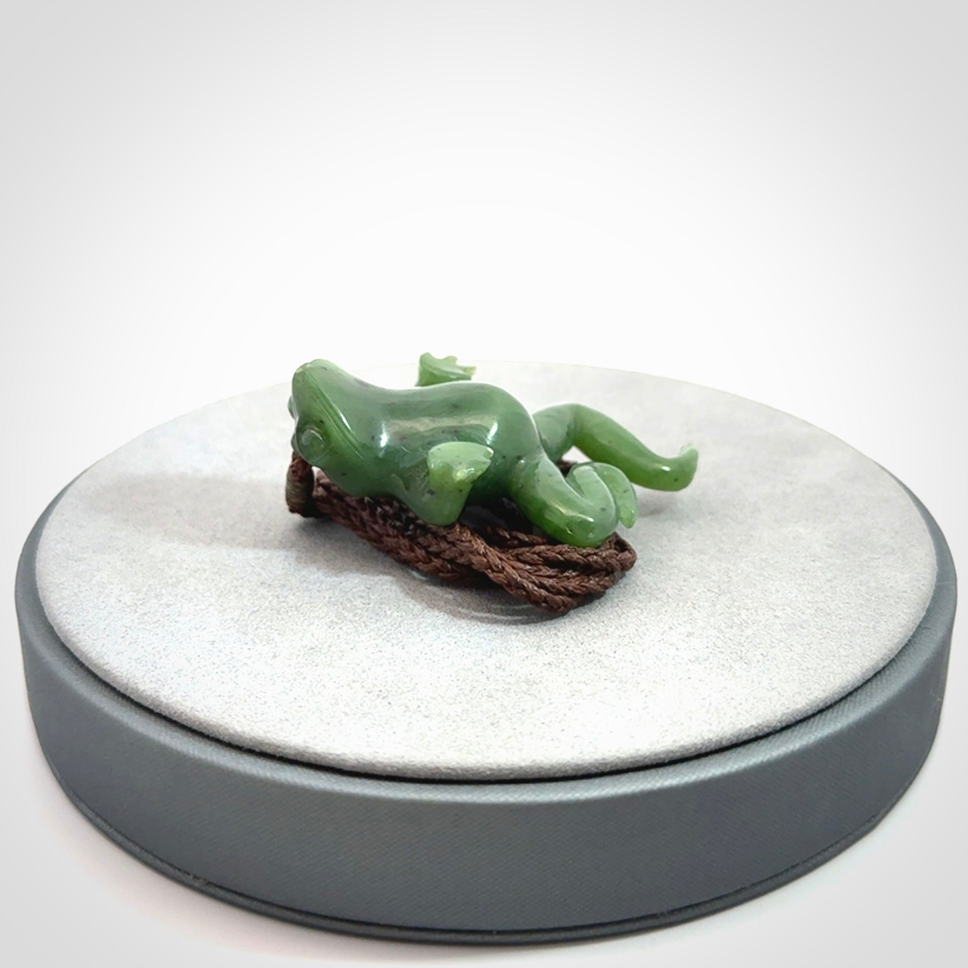 A hand carved jade frog pendant - he's carved to make you smile!