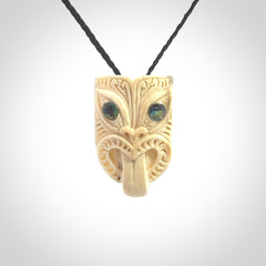 Hand carved Wheku pendant. Carved from woolly mammoth Tusk by NZ Pacific. Hand crafted Mammoth tusk jewellery for sale online. Provided with an adjustable cord and packaged in woven kete pouch.