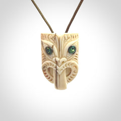 Hand carved Wheku pendant. Carved from woolly mammoth Tusk by NZ Pacific. Hand crafted Mammoth tusk jewellery for sale online. Provided with an adjustable cord and packaged in woven kete pouch.