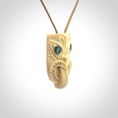 Hand carved Wheku pendant. Carved from woolly mammoth Tusk by NZ Pacific. Hand crafted Mammoth tusk jewellery for sale online. Provided with an adjustable cord and packaged in woven kete pouch.