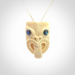 Hand carved Wheku pendant. Carved from woolly mammoth Tusk by NZ Pacific. Hand crafted Mammoth tusk jewellery for sale online. Provided with an adjustable cord and packaged in woven kete pouch.
