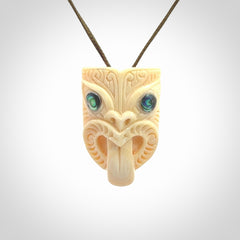 Hand carved Wheku pendant. Carved from woolly mammoth Tusk by NZ Pacific. Hand crafted Mammoth tusk jewellery for sale online. Provided with an adjustable cord and packaged in woven kete pouch.