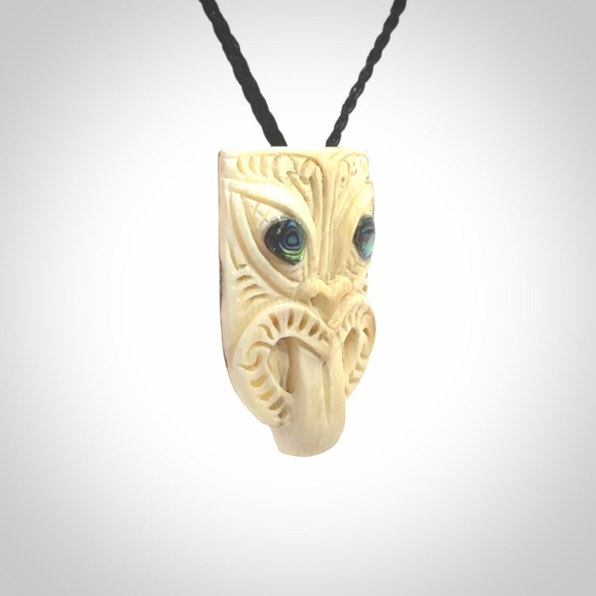 Hand carved Wheku pendant. Carved from woolly mammoth Tusk by NZ Pacific. Hand crafted Mammoth tusk jewellery for sale online. Provided with an adjustable cord and packaged in woven kete pouch.