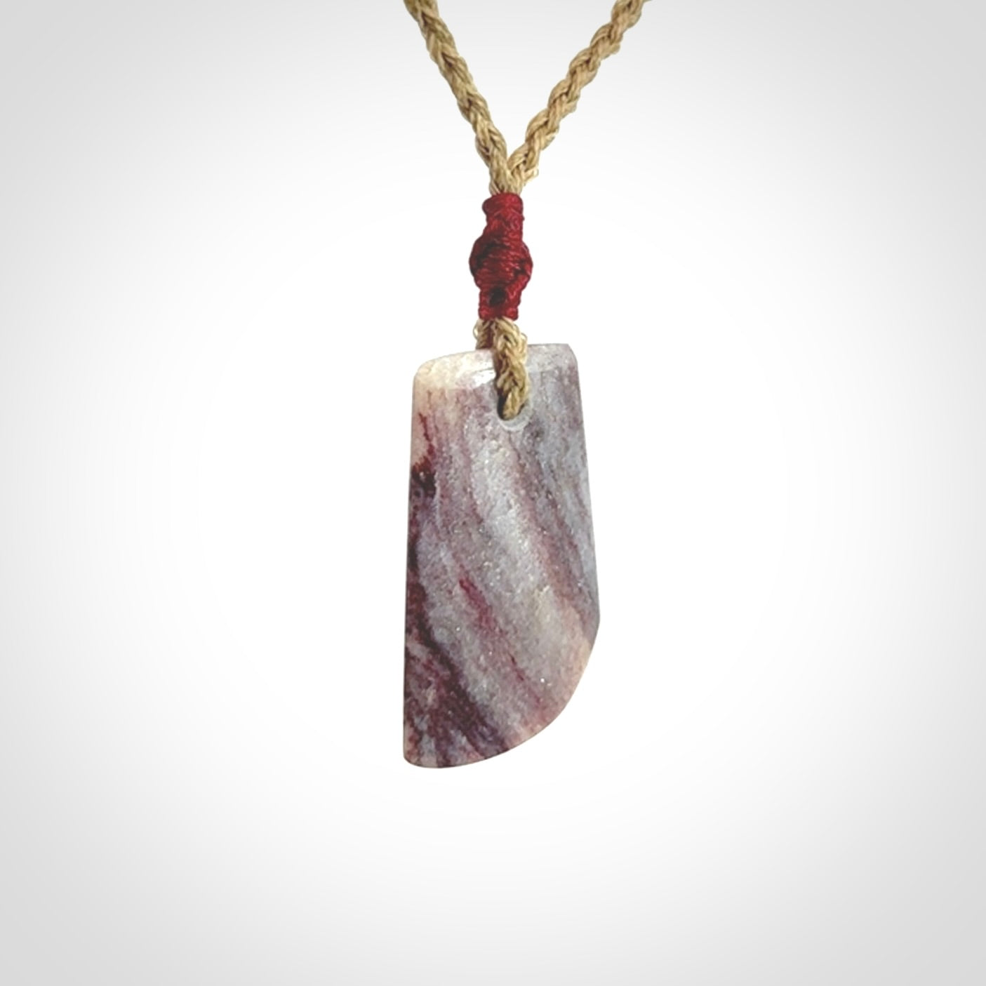 Hand carved Aroha stone toki pendant