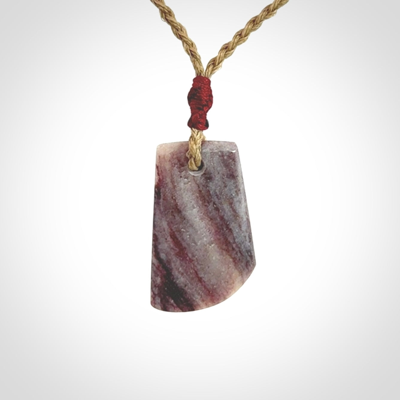 Hand carved Aroha stone toki pendant