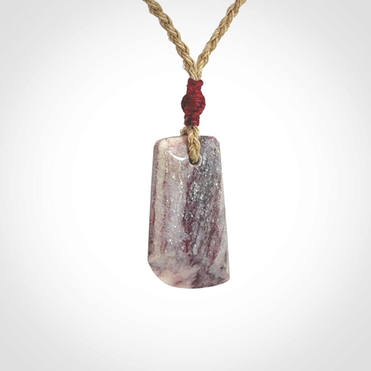 Hand carved Aroha stone toki pendant
