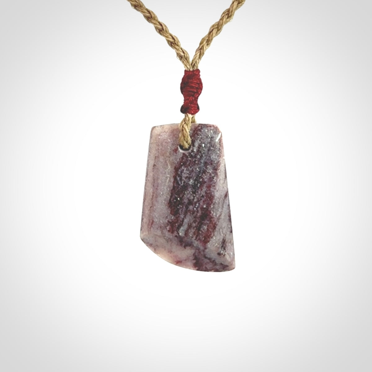 Hand carved Aroha stone toki pendant