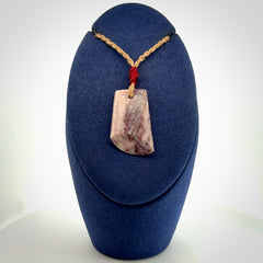 Hand carved Aroha stone toki pendant