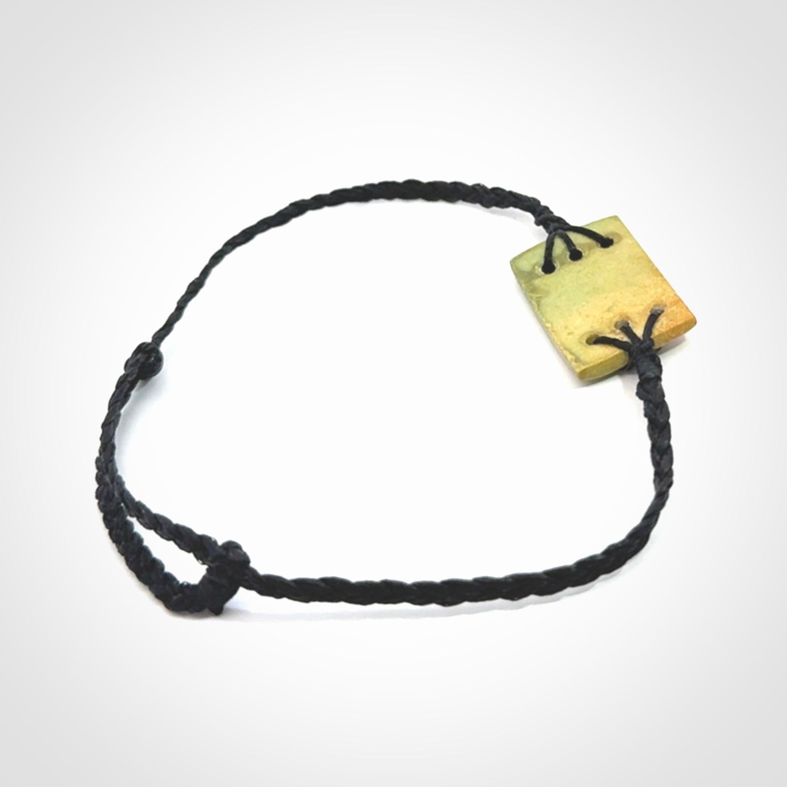 Hand carved New Zealand flower jade adjustable bracelet with black cord. One only armband for women and men.