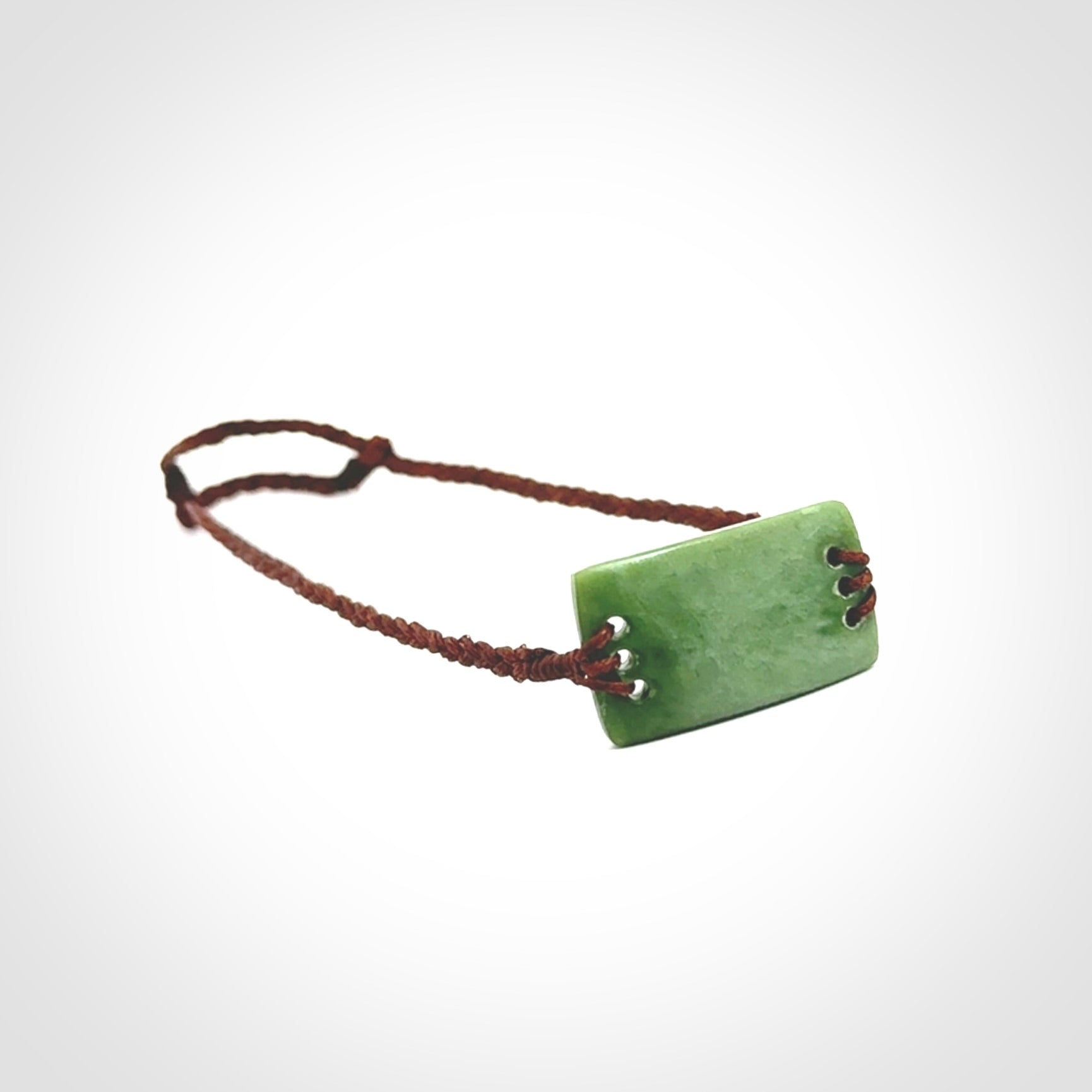 Hand carved New Zealand jade adjustable bracelet with brown cord. One only armband for women and men.