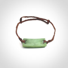 Hand carved New Zealand jade adjustable bracelet with brown cord. One only armband for women and men.
