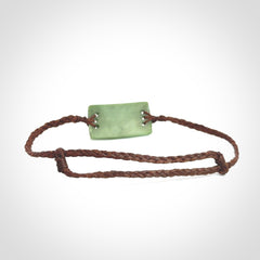 Hand carved New Zealand jade adjustable bracelet with brown cord. One only armband for women and men.