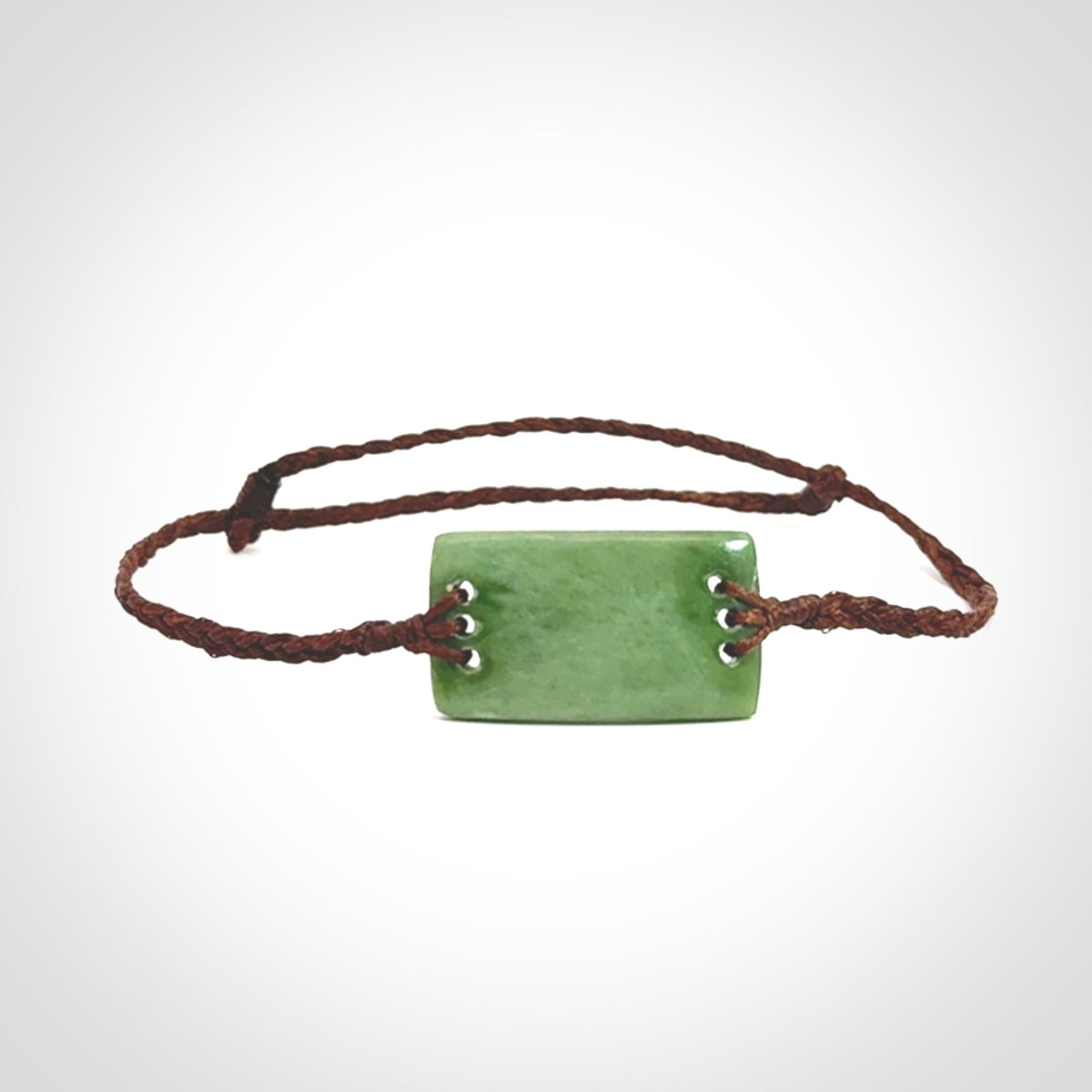 Hand carved New Zealand jade adjustable bracelet with brown cord. One only armband for women and men.
