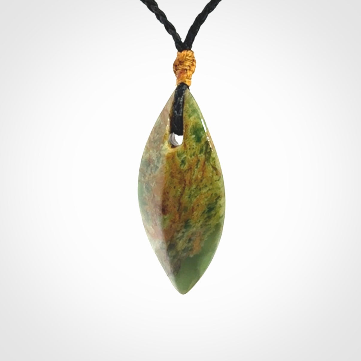 This picture shows a medium sized Flower Jade teardrop pendant. The pendant looks like a teardrop . A hand made unique and contemporary necklace hand carved here in New Zealand.