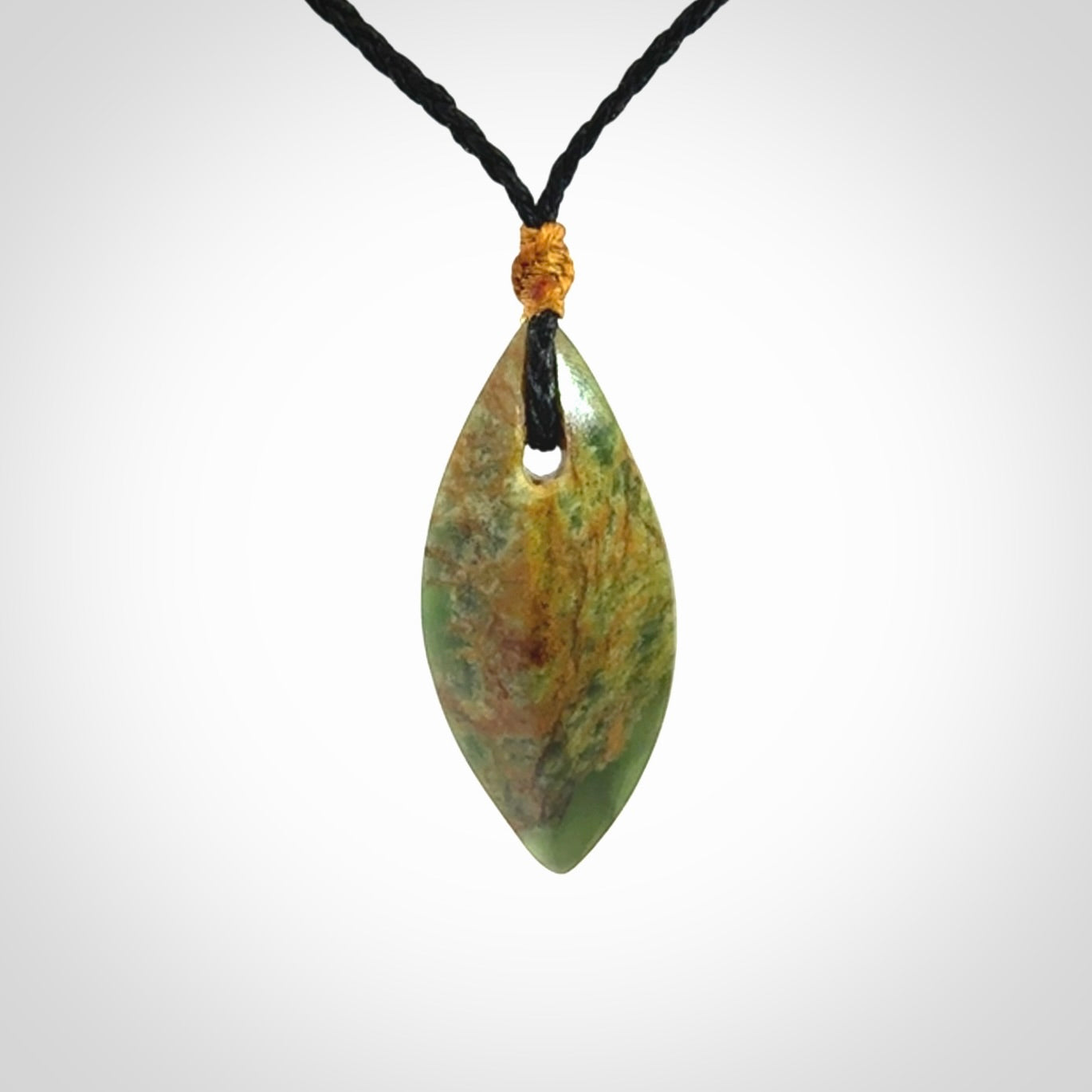 This picture shows a medium sized Flower Jade teardrop pendant. The pendant looks like a teardrop . A hand made unique and contemporary necklace hand carved here in New Zealand.