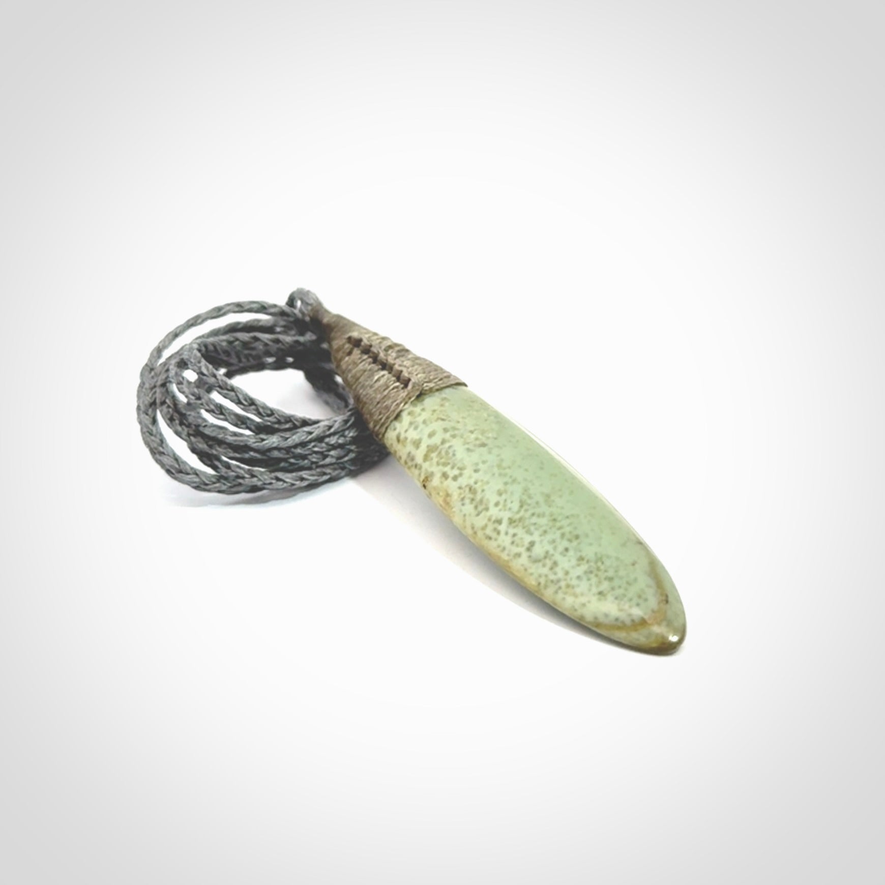 This picture shows a beautiful large sized drop pendant carved in New Zealand Jade, pounamu. A gorgeous and very meaningful pendant with an adjustable cord.