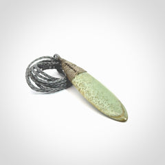 This picture shows a beautiful large sized drop pendant carved in New Zealand Jade, pounamu. A gorgeous and very meaningful pendant with an adjustable cord.