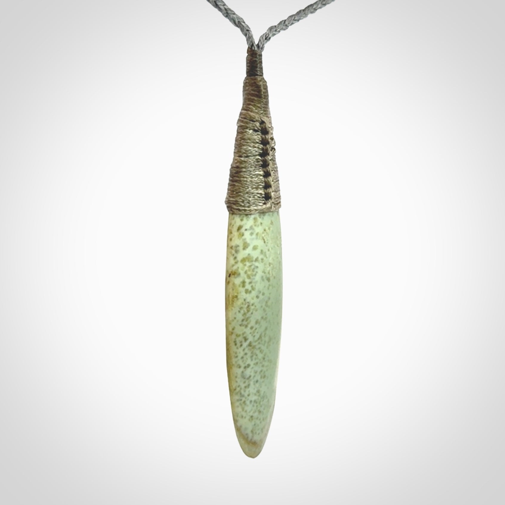 This picture shows a beautiful large sized drop pendant carved in New Zealand Jade, pounamu. A gorgeous and very meaningful pendant with an adjustable cord.