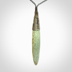 This picture shows a beautiful large sized drop pendant carved in New Zealand Jade, pounamu. A gorgeous and very meaningful pendant with an adjustable cord.