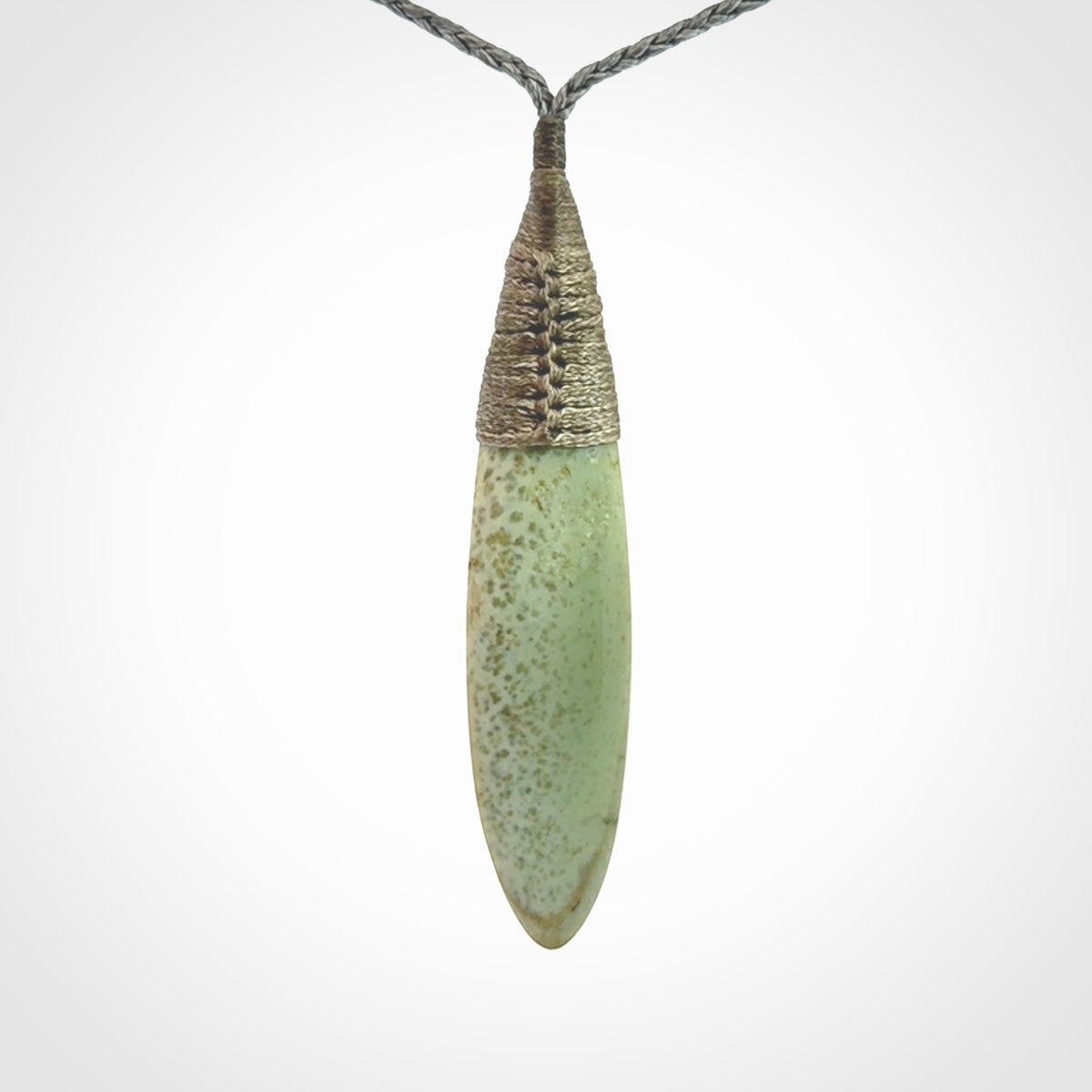This picture shows a beautiful large sized drop pendant carved in New Zealand Jade, pounamu. A gorgeous and very meaningful pendant with an adjustable cord.
