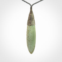 This picture shows a beautiful large sized drop pendant carved in New Zealand Jade, pounamu. A gorgeous and very meaningful pendant with an adjustable cord.