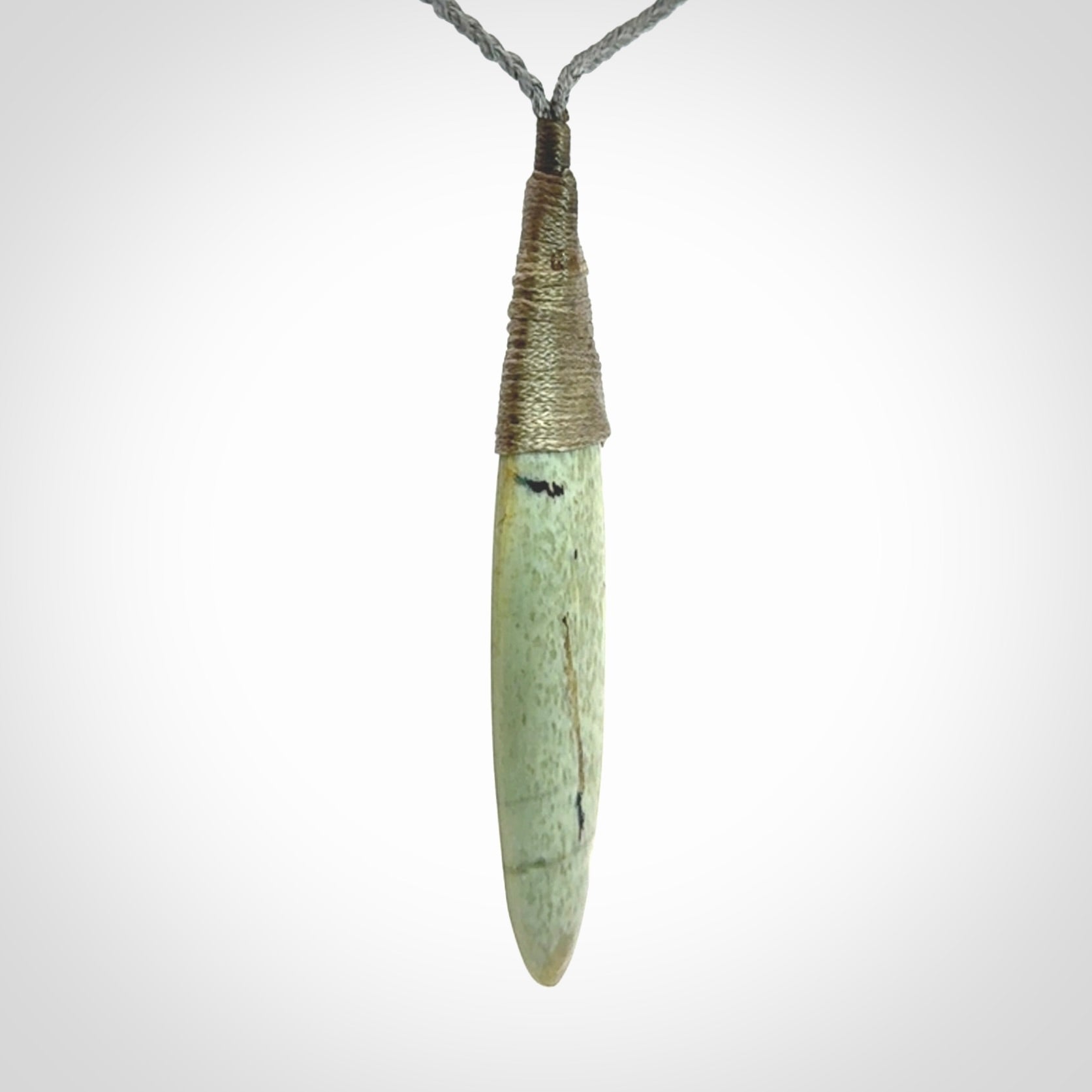 This picture shows a beautiful large sized drop pendant carved in New Zealand Jade, pounamu. A gorgeous and very meaningful pendant with an adjustable cord.