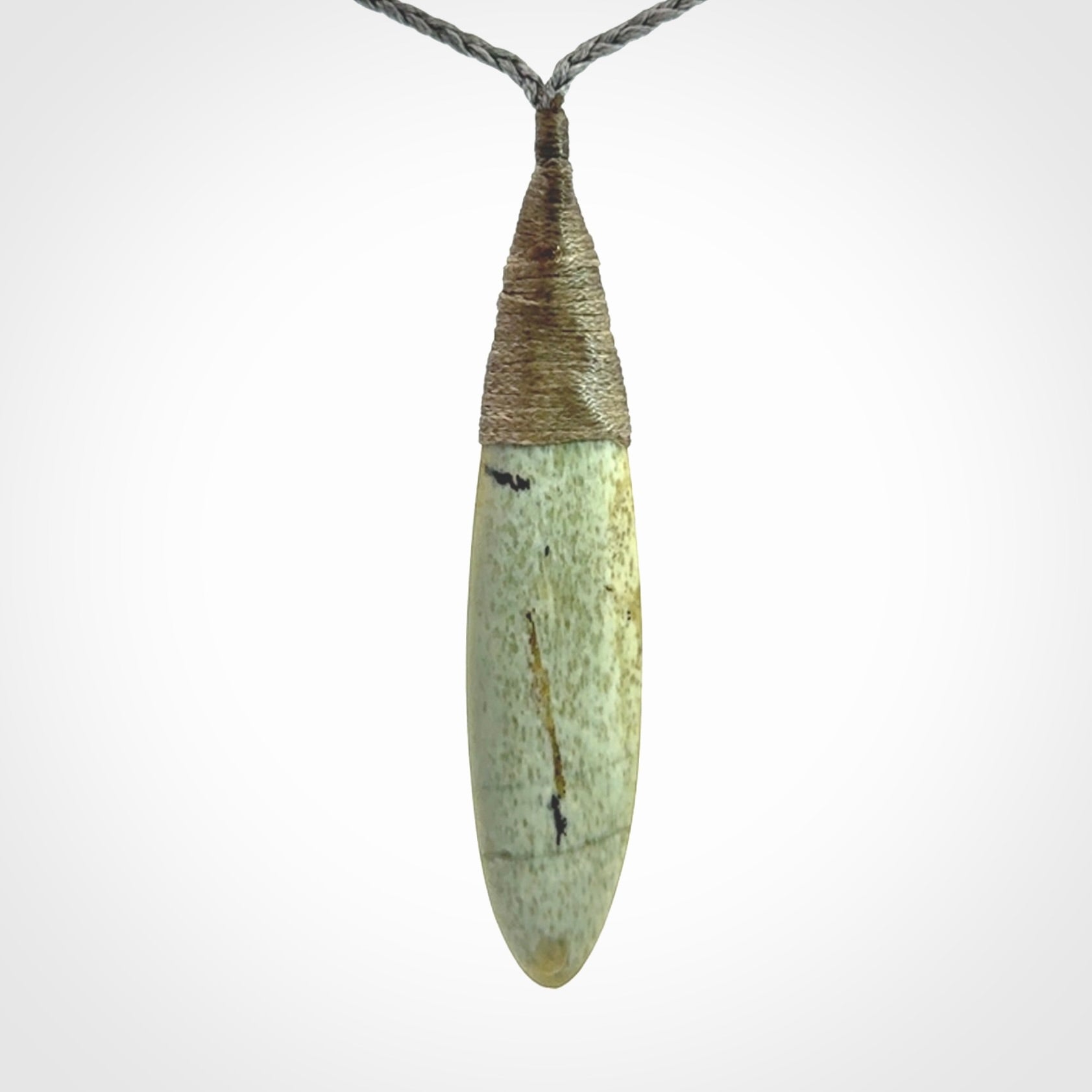 This picture shows a beautiful large sized drop pendant carved in New Zealand Jade, pounamu. A gorgeous and very meaningful pendant with an adjustable cord.