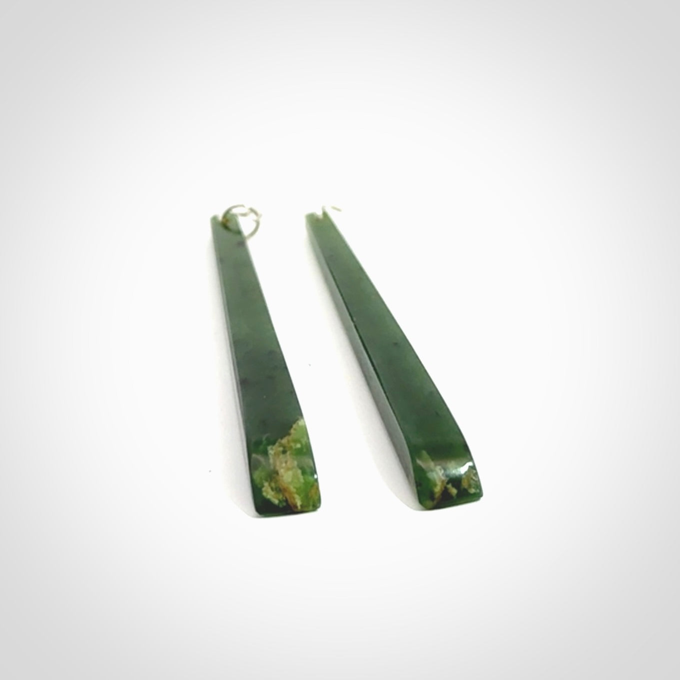 These are stunning large sized drop flower jade earrings carved in New Zealand. It is carved from a beautiful green piece of New Zealand Flower Jade and with Sterling Silver hooks and findings.