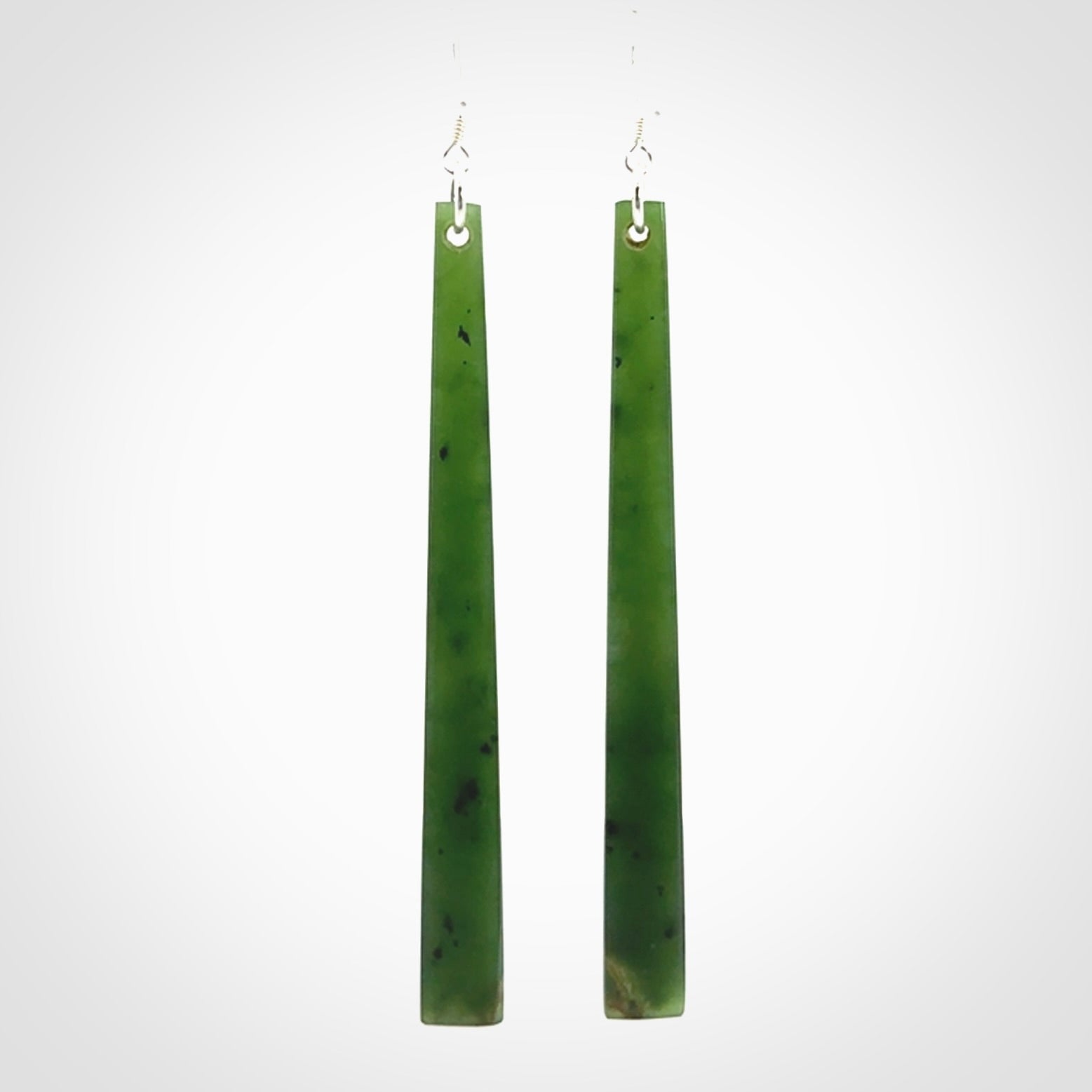 These are stunning large sized drop flower jade earrings carved in New Zealand. It is carved from a beautiful green piece of New Zealand Flower Jade and with Sterling Silver hooks and findings.