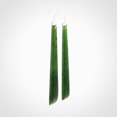 These are stunning large sized drop flower jade earrings carved in New Zealand. It is carved from a beautiful green piece of New Zealand Flower Jade and with Sterling Silver hooks and findings.