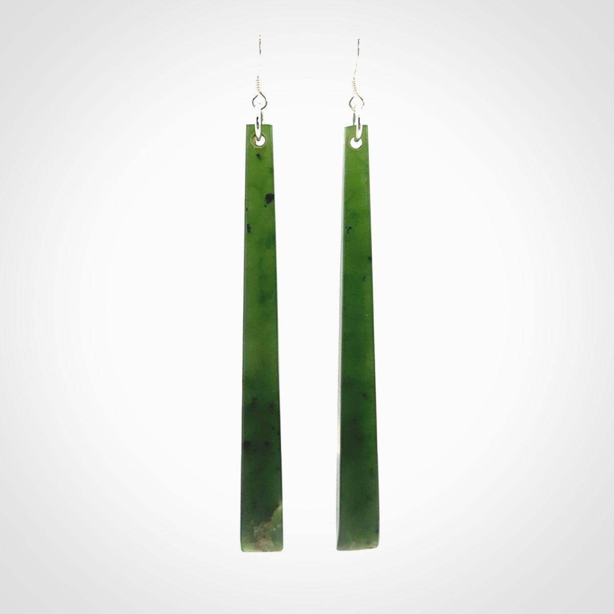 These are stunning large sized drop flower jade earrings carved in New Zealand. It is carved from a beautiful green piece of New Zealand Flower Jade and with Sterling Silver hooks and findings.