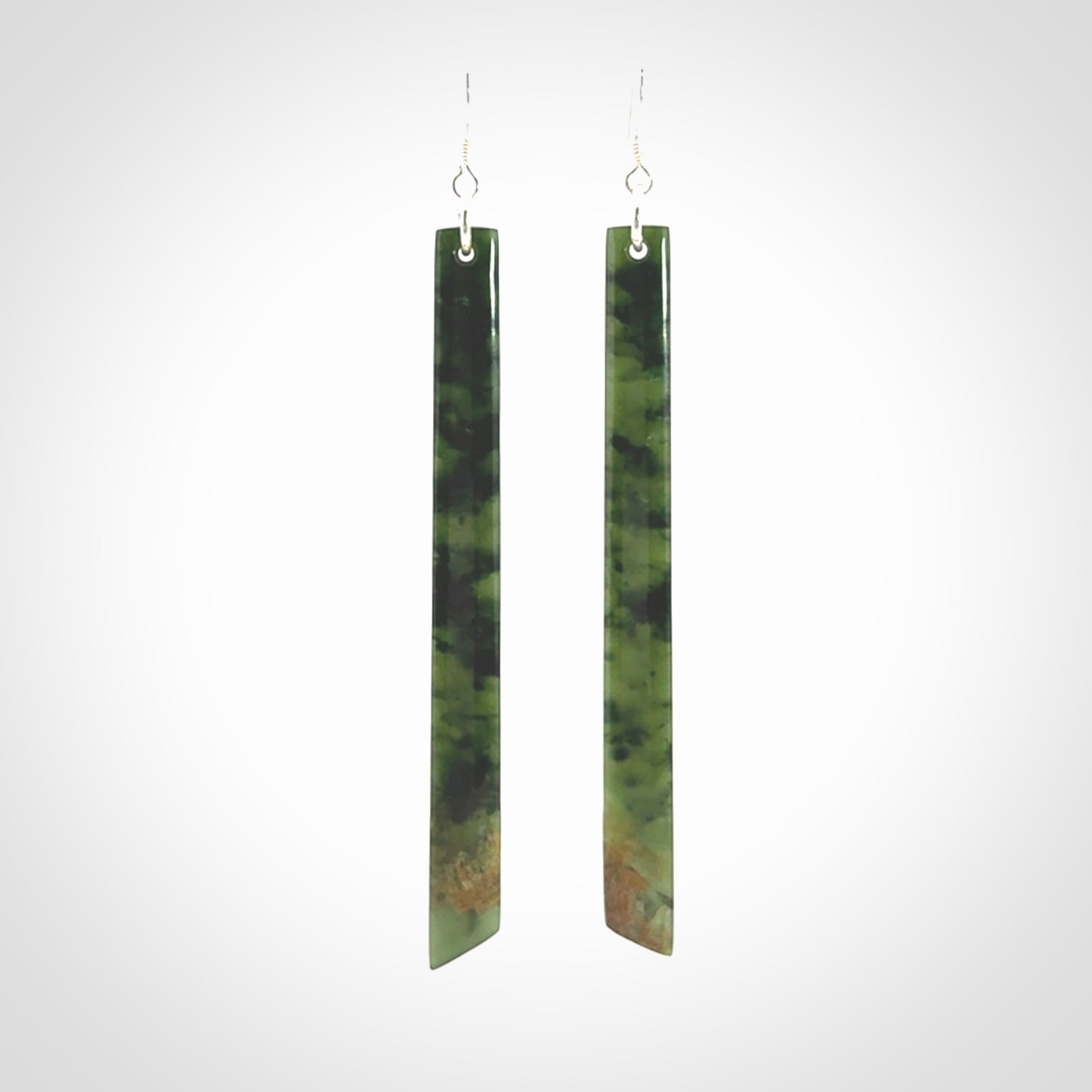 These are stunning large sized drop flower jade earrings carved in New Zealand. It is carved from a beautiful green piece of New Zealand Flower Jade and with Sterling Silver hooks and findings.