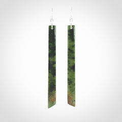 These are stunning large sized drop flower jade earrings carved in New Zealand. It is carved from a beautiful green piece of New Zealand Flower Jade and with Sterling Silver hooks and findings.