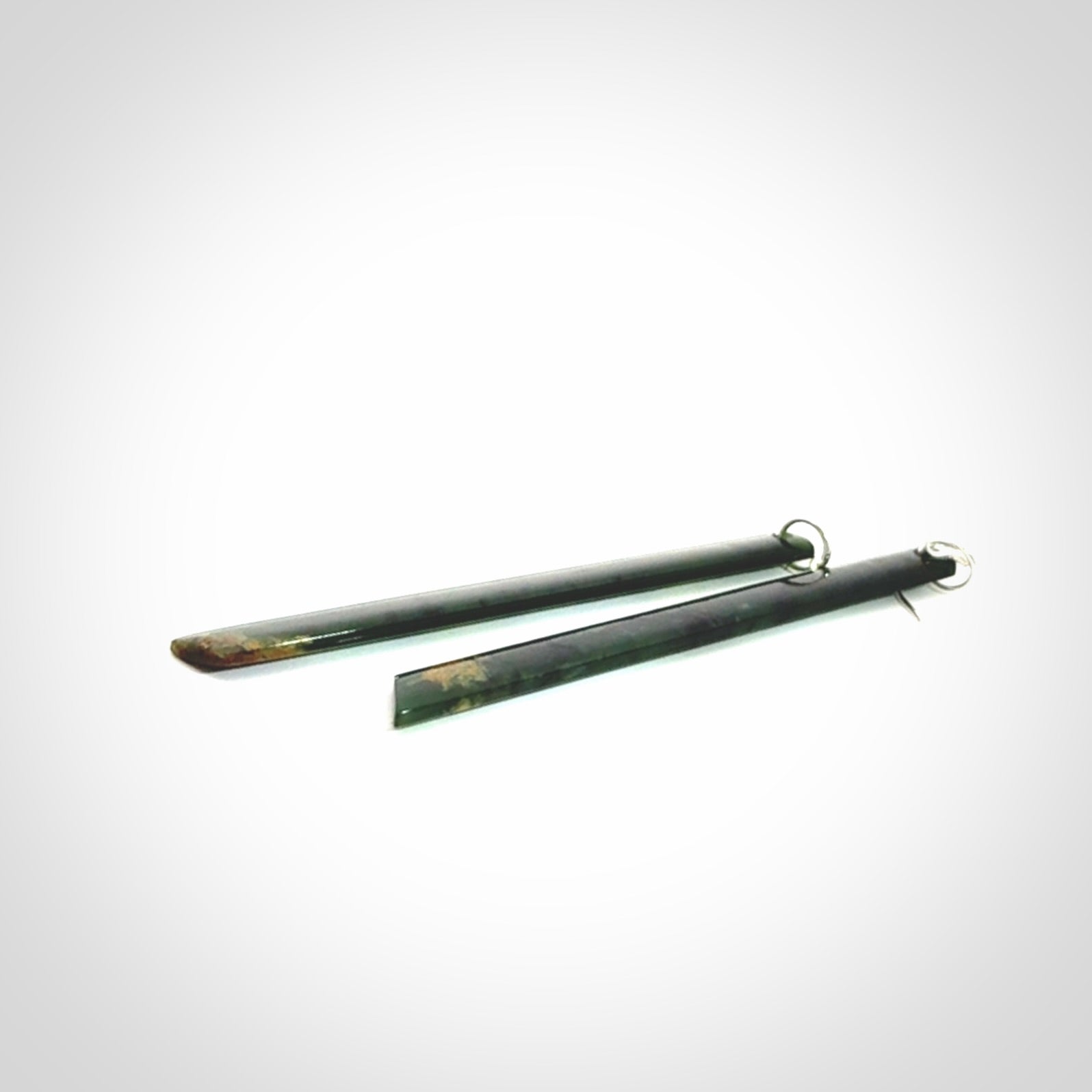 These are stunning large sized drop flower jade earrings carved in New Zealand. It is carved from a beautiful green piece of New Zealand Flower Jade and with Sterling Silver hooks and findings.