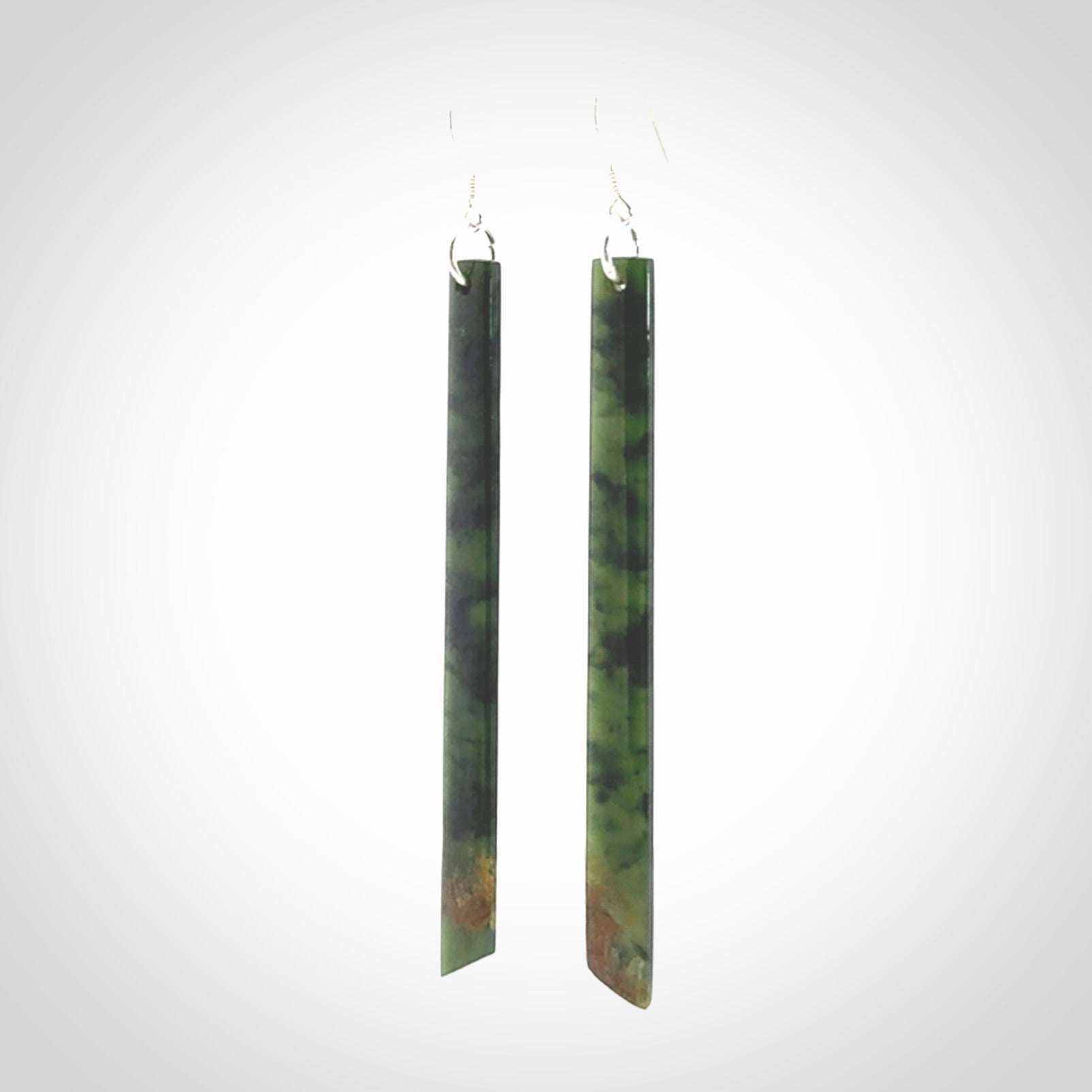 These are stunning large sized drop flower jade earrings carved in New Zealand. It is carved from a beautiful green piece of New Zealand Flower Jade and with Sterling Silver hooks and findings.