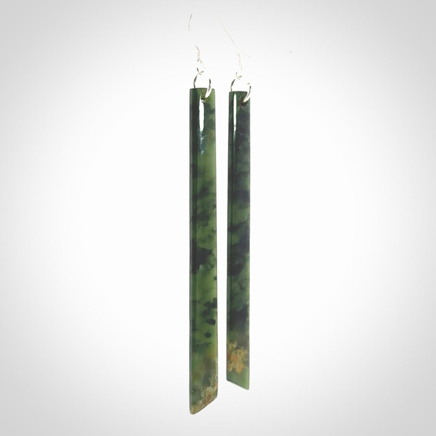 These are stunning large sized drop flower jade earrings carved in New Zealand. It is carved from a beautiful green piece of New Zealand Flower Jade and with Sterling Silver hooks and findings.