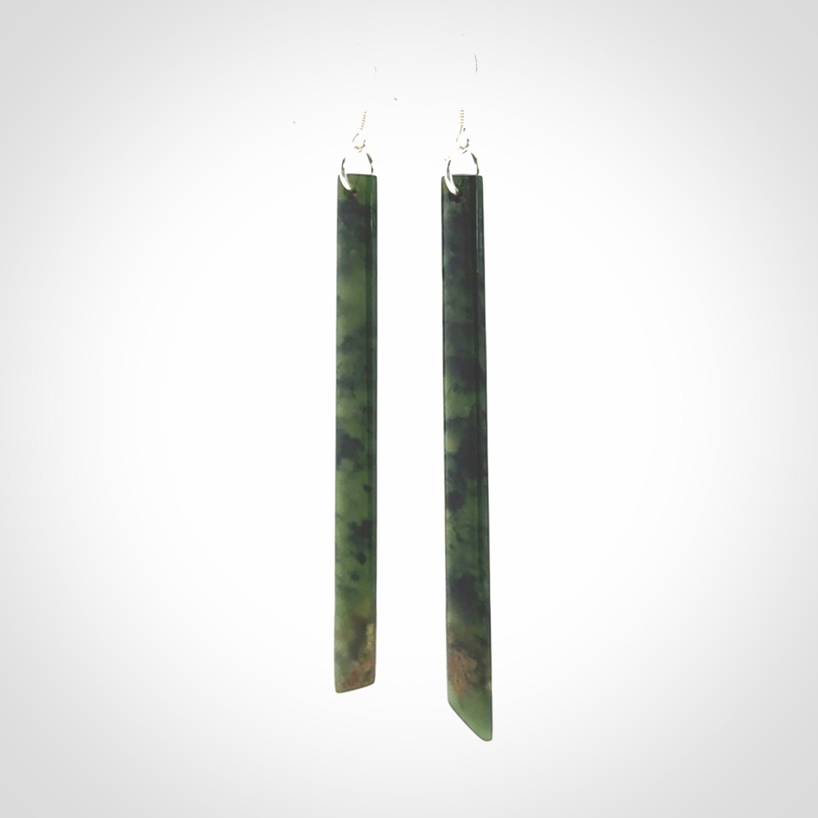 These are stunning large sized drop flower jade earrings carved in New Zealand. It is carved from a beautiful green piece of New Zealand Flower Jade and with Sterling Silver hooks and findings.