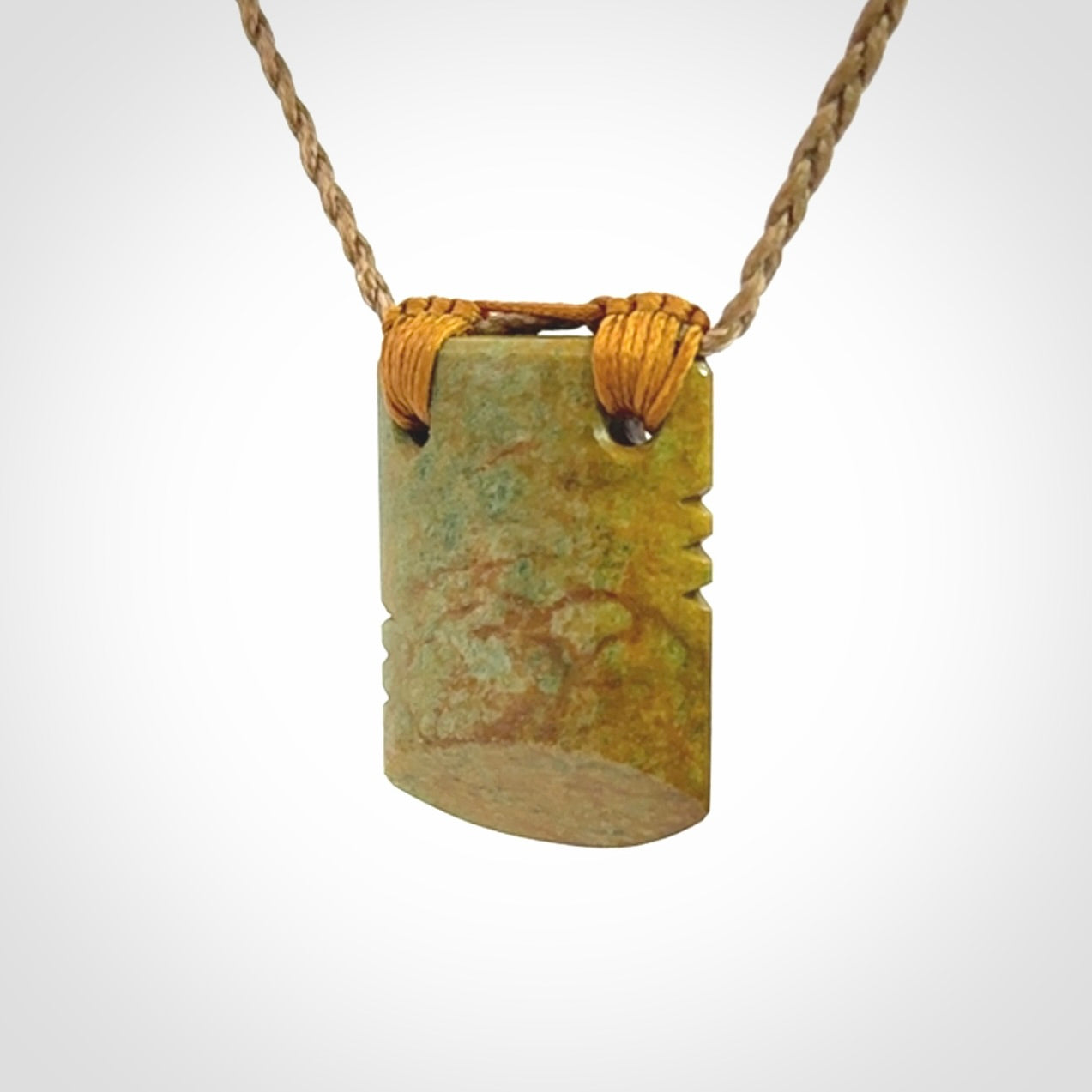 Hand carved New Zealand Flower Jade drop pendant.