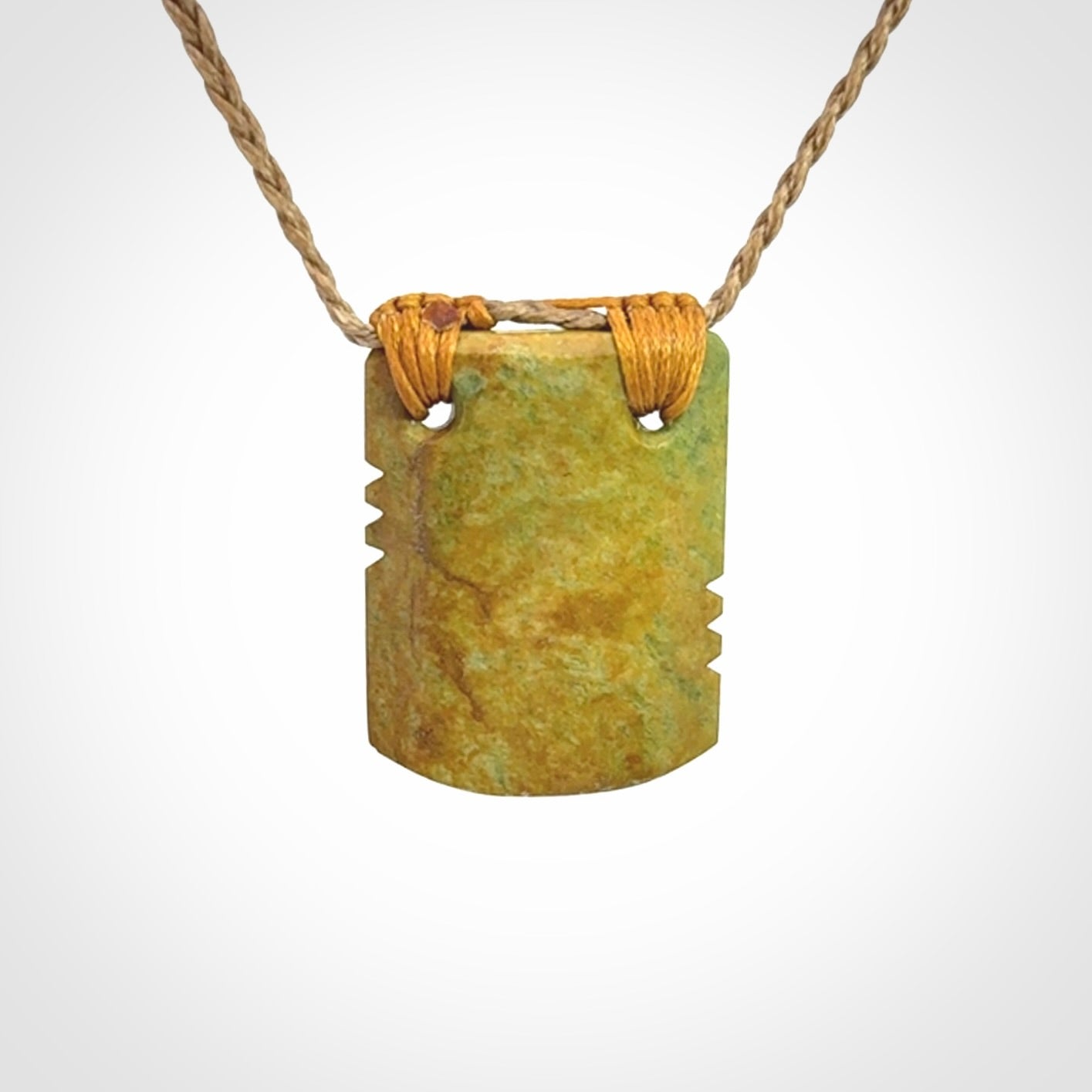 Hand carved New Zealand Flower Jade drop pendant.