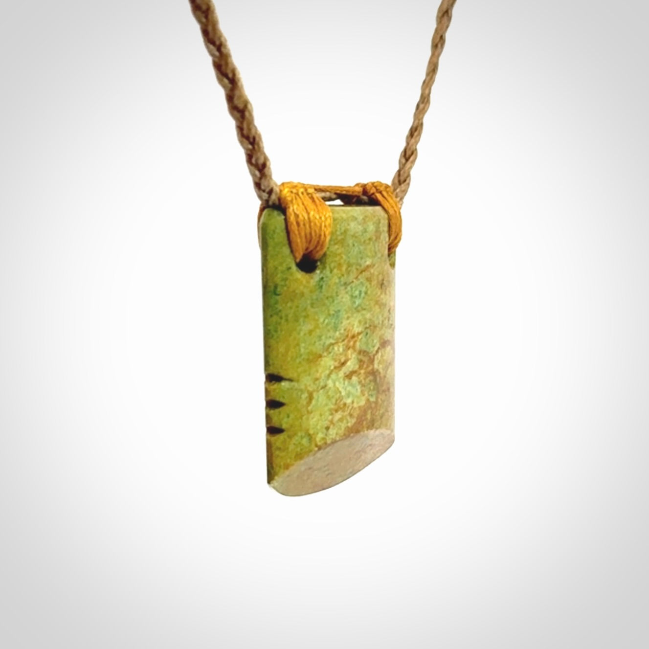 Hand carved New Zealand Flower Jade drop pendant.