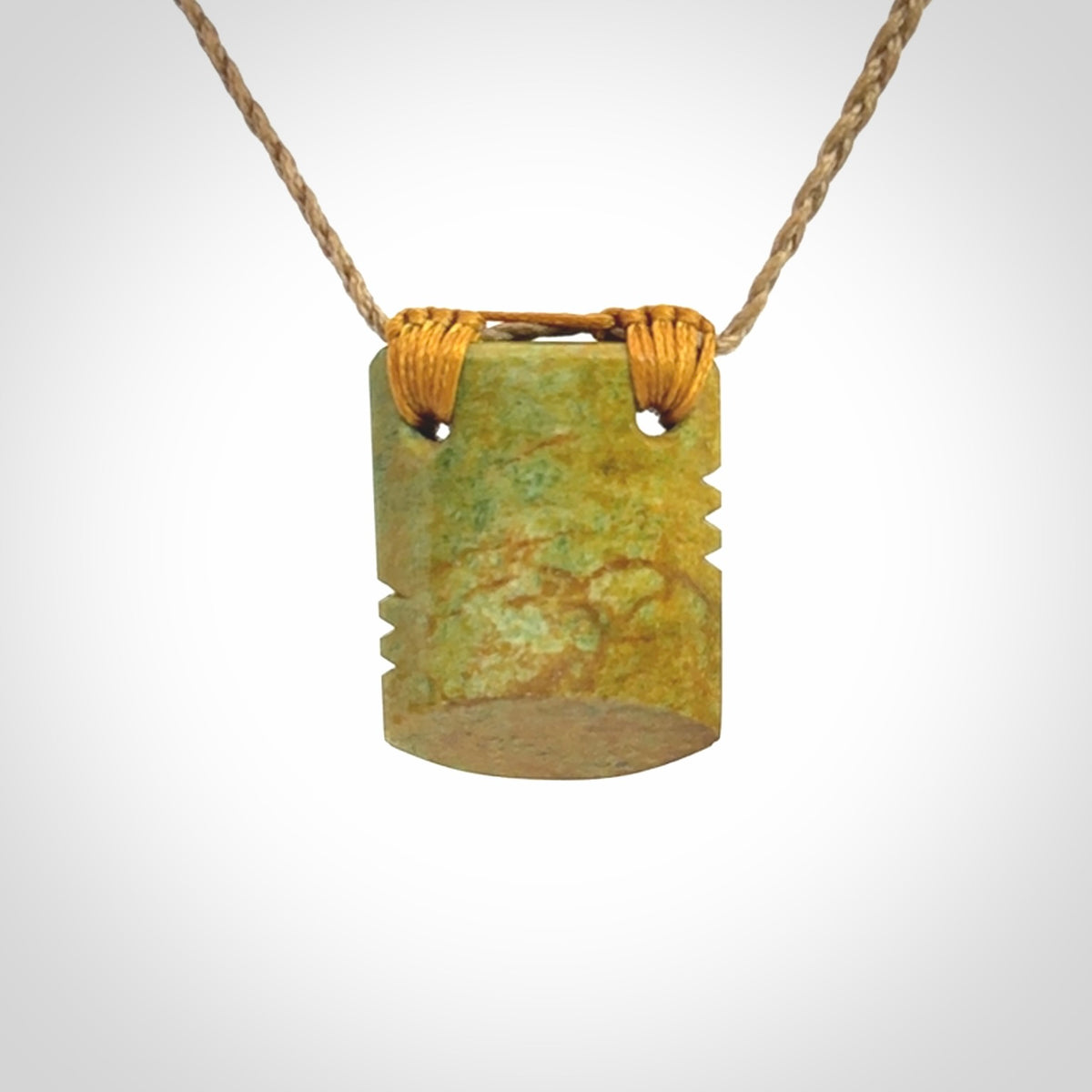 Hand carved New Zealand Flower Jade drop pendant.