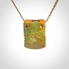 Hand carved New Zealand Flower Jade drop pendant.