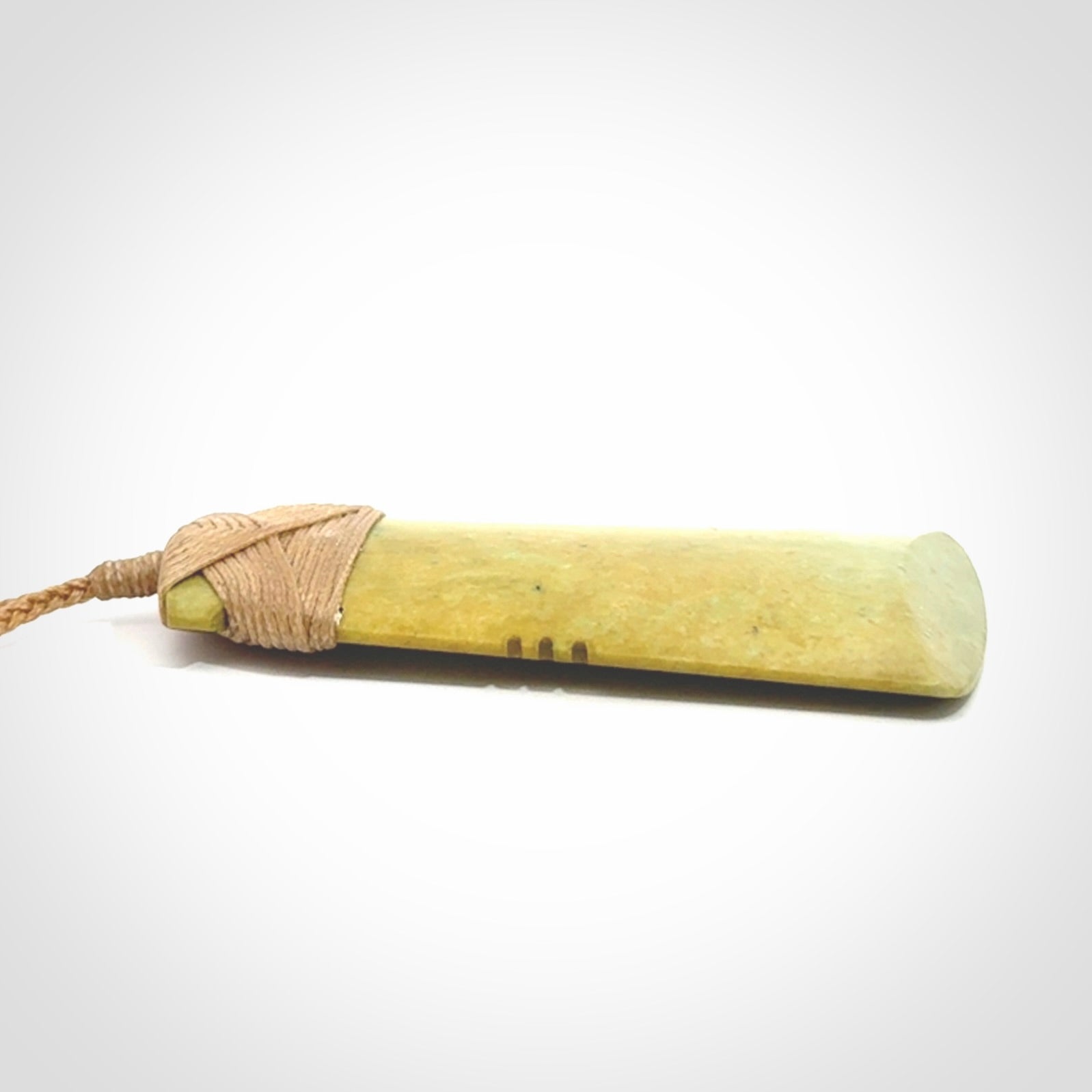 This is a lovely notched toki pendant made from a gorgeous New Zealand Flower Jade.