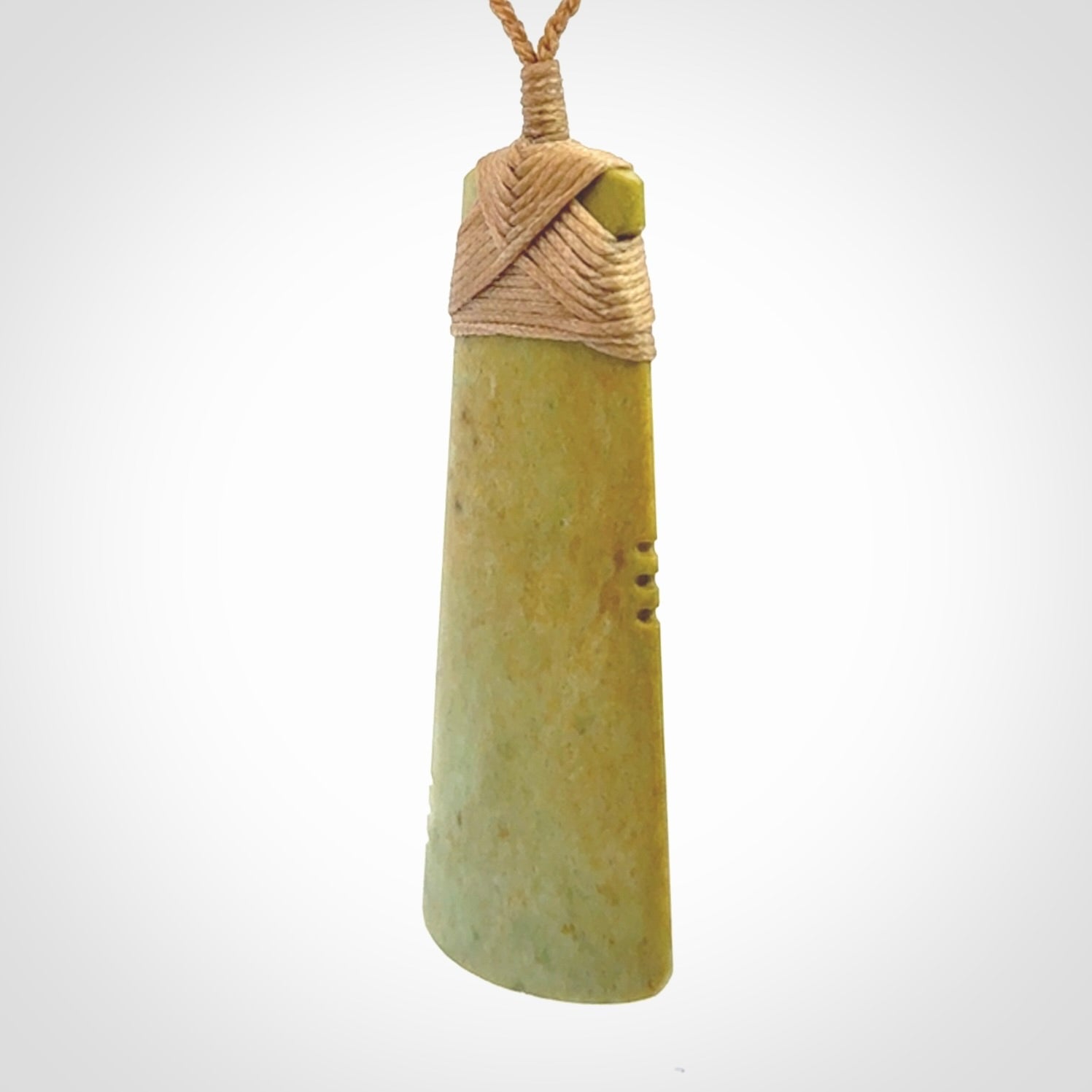 This is a lovely notched toki pendant made from a gorgeous New Zealand Flower Jade.
