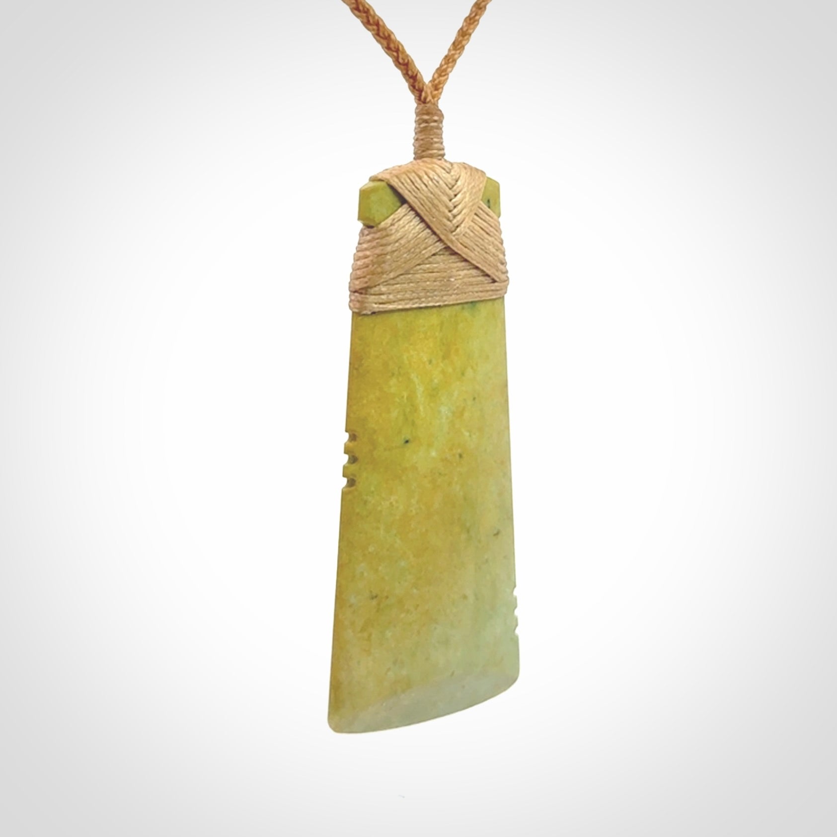 This is a lovely notched toki pendant made from a gorgeous New Zealand Flower Jade.