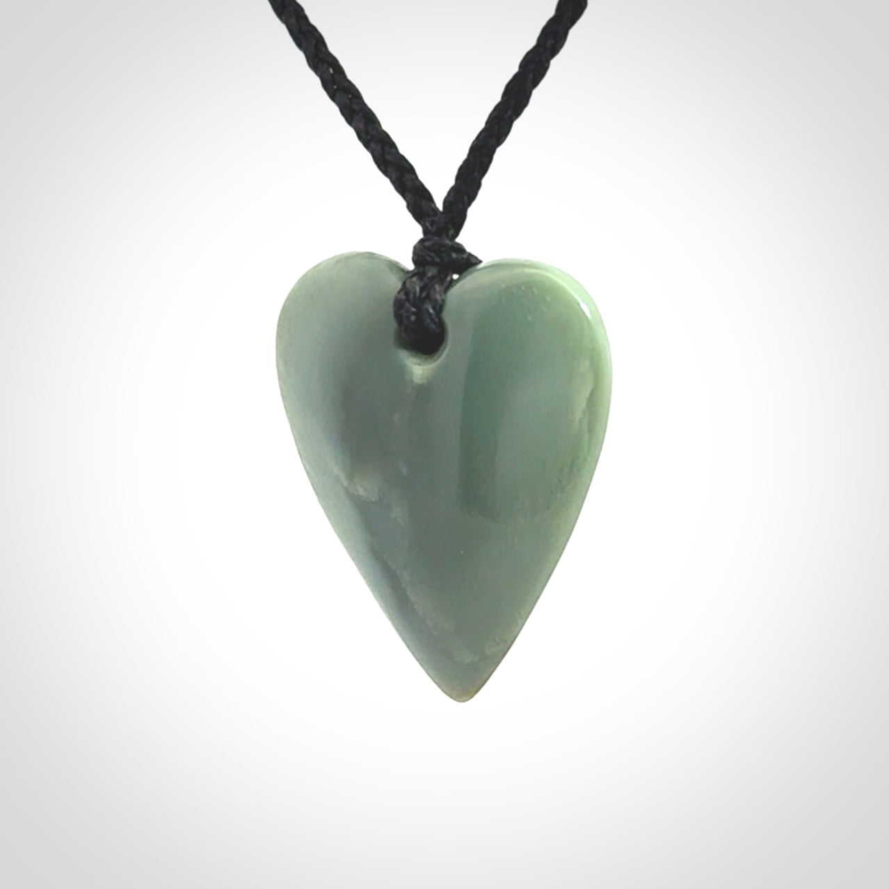 A hand carved small heart pendant made from New Zealand Inanga jade.